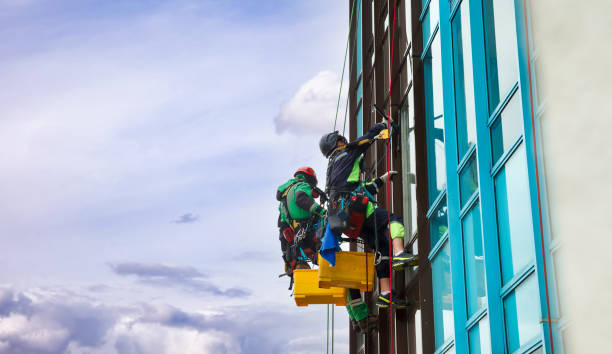 istock Industrial mountaineering workers hangs over residential facade building 1324364050