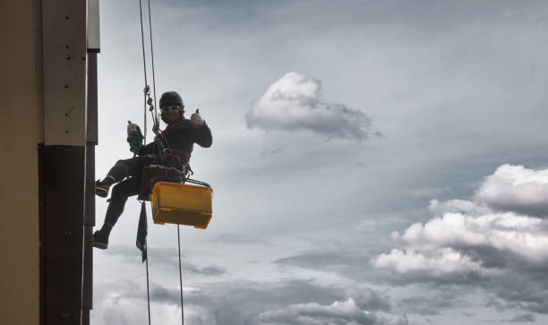 istock Industrial mountaineering worker hangs over residential facade 1324364081