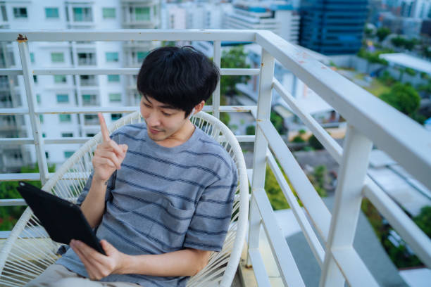 istock Man working alone at his apartment. 1324364998