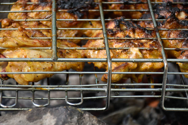 istock Chicken meat barbecue cooking on fire. 1324366228