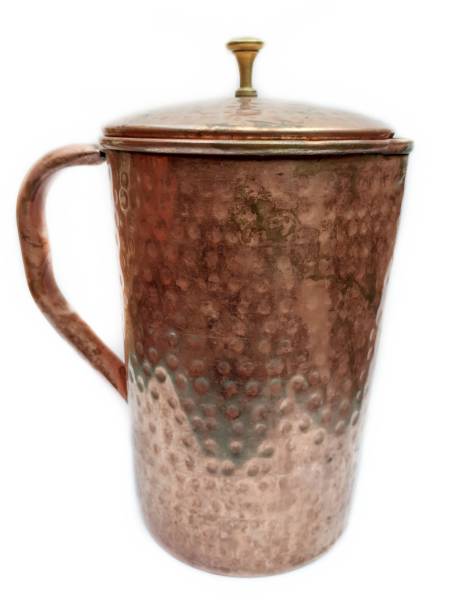 istock Old copper jug isolated on white background 1324368662