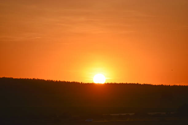 istock Sunset horizon with sun and clouds in the evening 1324369683