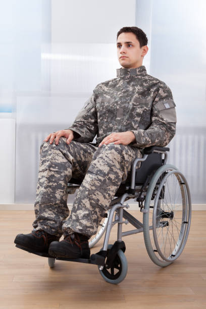 istock Patriotic Soldier Sitting On Wheel Chair 1324370802