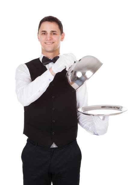istock Waiter Holding Lid Cover Over Empty Tray 1324370810