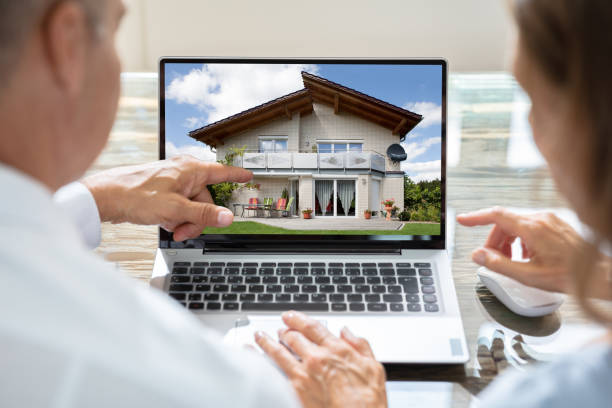 istock Businesspeople Looking At House On Laptop 1324371319
