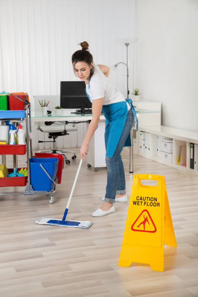 istock Female Janitor Mopping Wooden Floor 1324371380