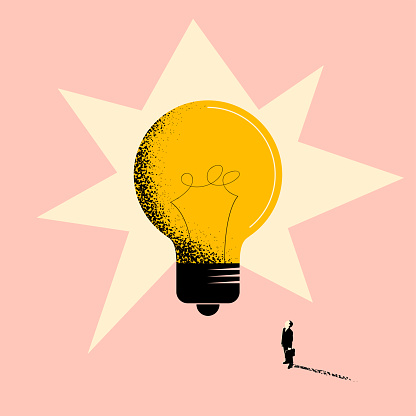 Business idea or business creativity concept with businessman standing in front of a huge light bulb and looking on it. Vector eps 10 illustration