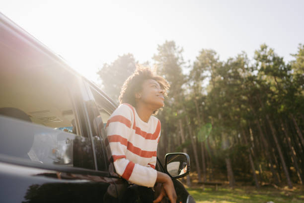 istock Young woman riding in a car 1324377868