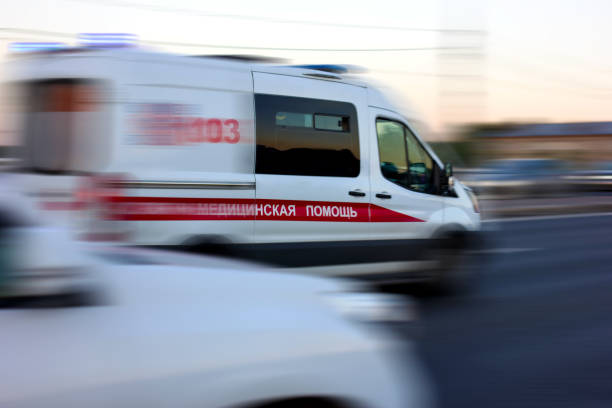 An ambulance rushes to the aid of a patient Photo taken on the bridge in the Otradnoye district, Moscow, in the summer of 2021, car, sky, traffic. ambulance stock pictures, royalty-free photos & images