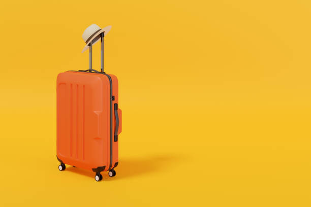 istock Suitcase with hat isolated on yellow background with copy space. 3d illustration. 1324380679