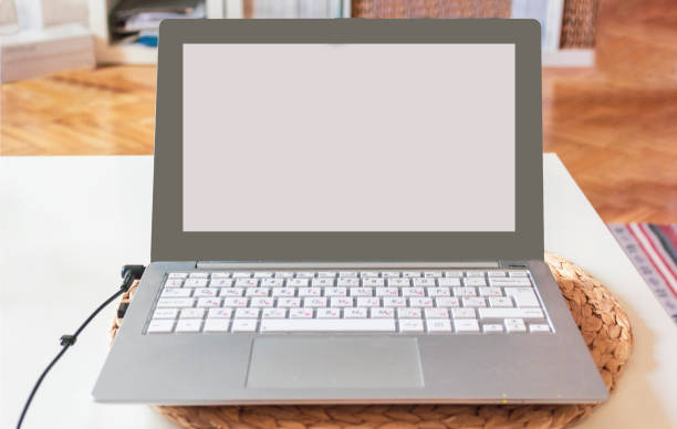 istock Laptop with blank screen on the table at home. 1324382779