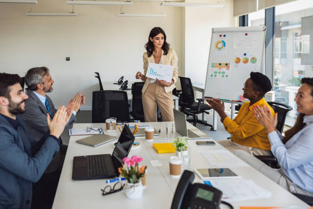 istock Professional financial experts collaborating during brainstorming meeting listening information from clever female director, businesswoman providing information to corporate workers of company 1324384367