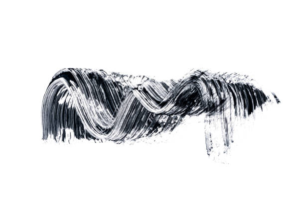 istock Black smear mascara on white background. Isolated. Makeup. Cosmetic products for eyelashes. Closeup. Beautiful pattern for design. 1324385348