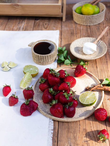 istock Strawberries on a ceramic plate on a wooden background 1324386460