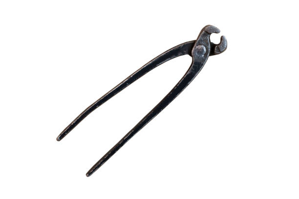 Vintage metal nippers isolated on a white background. Pincers, tool for removing nails from wood. Old open rusty pinching pliers to used for removing nails from wood.