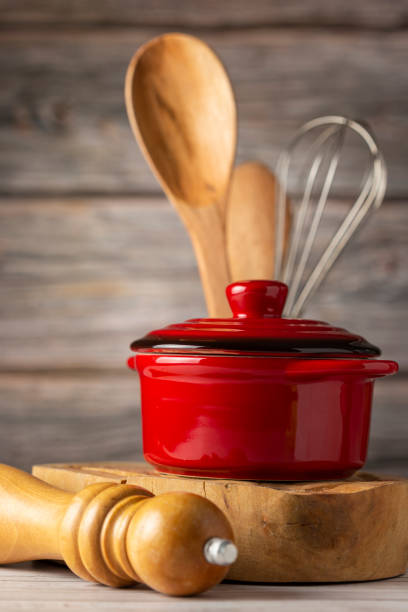 istock kitchen utensils on wooden background. 1324387698