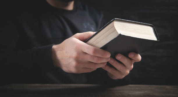 istock Caucasian man holding bible. Religion 1324389594