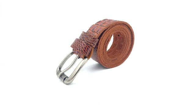 istock brown crocodile leather belt on isolated white 1324390022