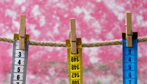 istock colorful measure tape hanging on clothesline 1324392728
