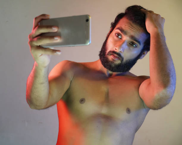 istock a healthy man taking selfie using his phone 1324393596