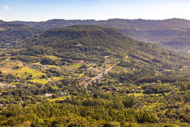 istock Countryside view with forest, mountains and small farms 1324393801