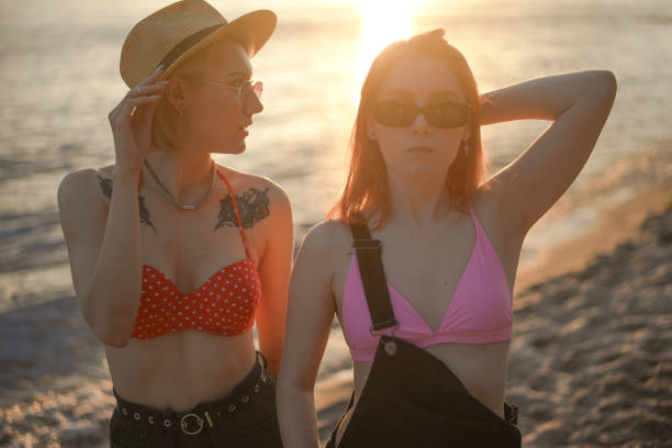 istock Two LGBTQIA+ lesbian folks having fun in summer at sunset 1324394803
