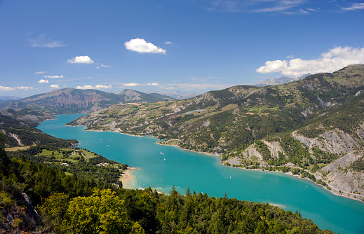 Scenic view of the Nation Park of the Ecrins during summer time in Haute Provence Alps, France. (artificial lake)