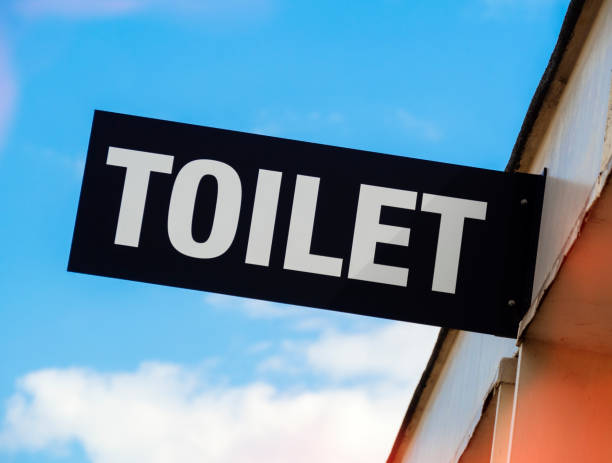 istock Toilet sign against blue sky 1324398741