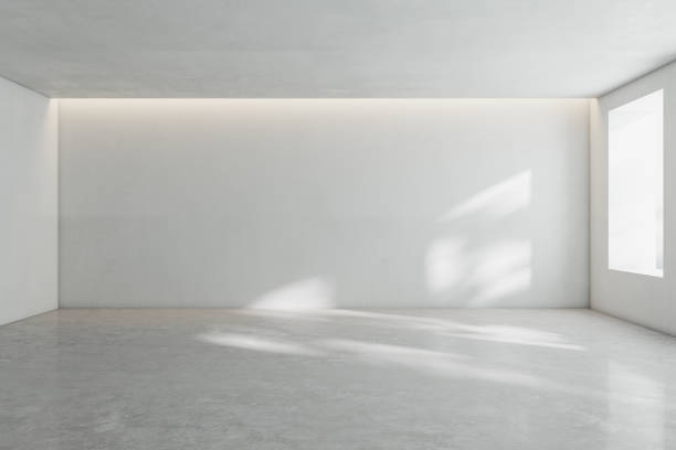 istock Sunny spacious hall room with blank wall, light glossy concrete floor and window. 3D rendering, mock up 1324400212