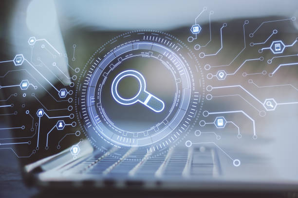 istock Laptop with abstract glowing digital business interface with search icon on blurry background. Double exposure. 1324400368