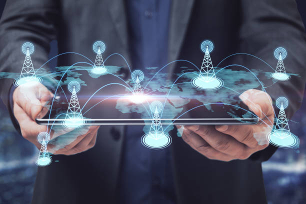 istock Businessman hand holding tablet with creative glowing digital map with location pins on blurry background. Double exposure. 1324400941