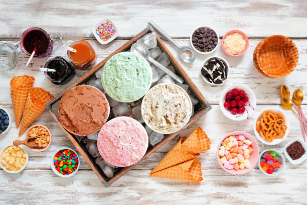 istock Summer ice cream bar top view table scene on a rustic white wood background 1324402416