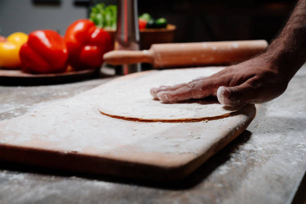 istock men's hands sprinkle flatbread with flour. simple baking recipes 1324402491
