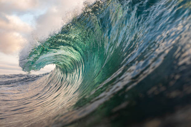 istock Teal Green Ocean Wave forming in deep blue ocean 1324402697
