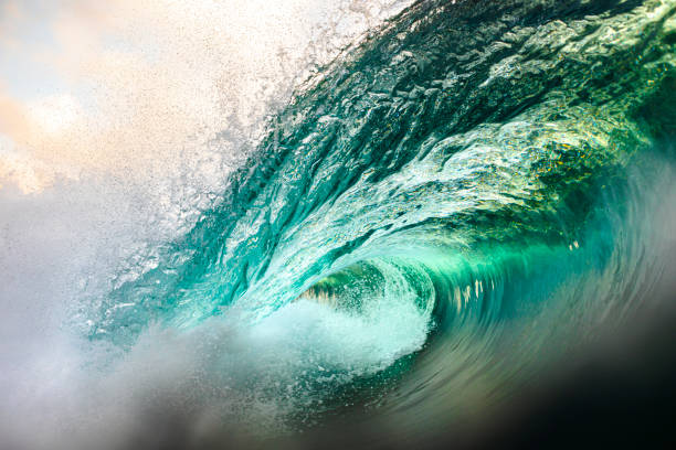 istock Emerald Green Ocean Wave Crashing in Morning Light 1324402789