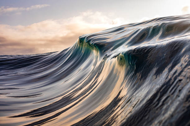 istock Motion Blur of smooth golden Ocean Surface 1324403838