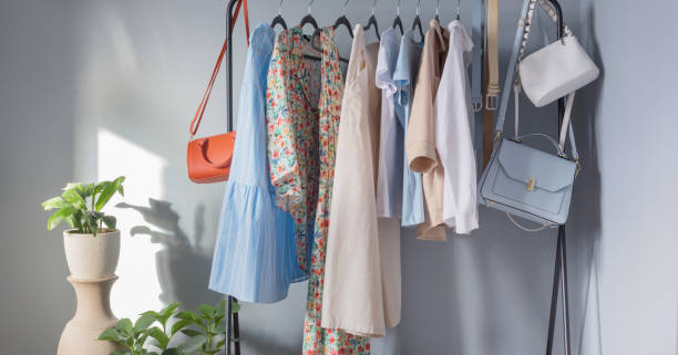 istock light colored womens summer clothes and shoes on  hanger 1324405007