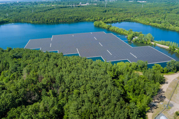 Panorama view in solar cell generator or solar panel, an alternative power generation floating on lake water space Panorama view in solar cell generator or solar panel, an alternative power generation floating on the lake water space floating electric generator stock pictures, royalty-free photos & images
