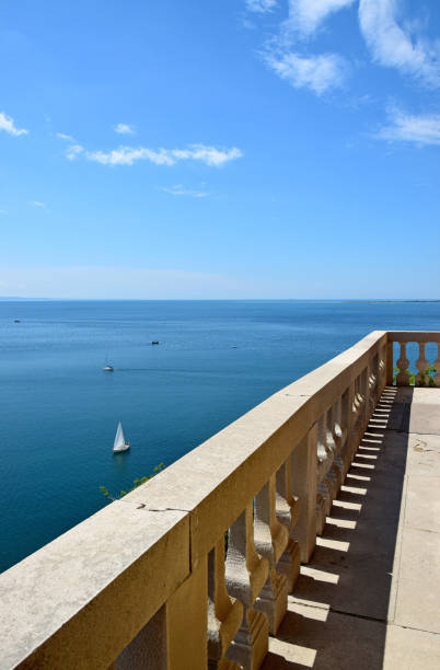 istock White marble balcony on a deep blue sea 1324409231