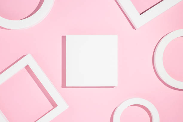 istock White presentation podiums geometric shapes on a pink background. Top view, flat lay 1324412299
