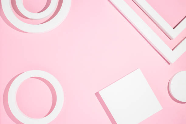 istock White presentation podiums geometric shapes on a pink background. Top view, flat lay 1324412306