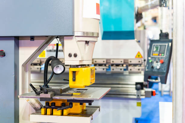 istock punch die or shear set on table semi automatic hydraulic press machine for forming cutting shearing notching punching or hole making of metal sheet in manufacturing process in industrial 1324412488