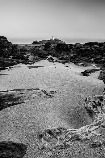 Beautiful and unusual landscape image of Godrevy lighthouse on Cornwall's coastline