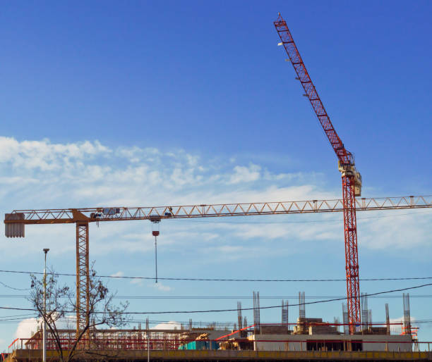 istock Construction crane on the background of the sky. Construction site. 1324417684
