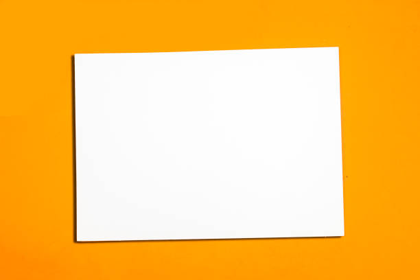 istock Blank A4 photorealistic landscape brochure mockup on orange background 1324425738