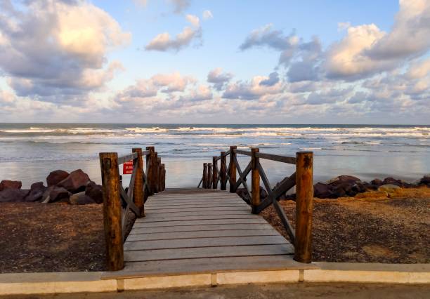 istock photographing late afternoon on the beach 1324429732