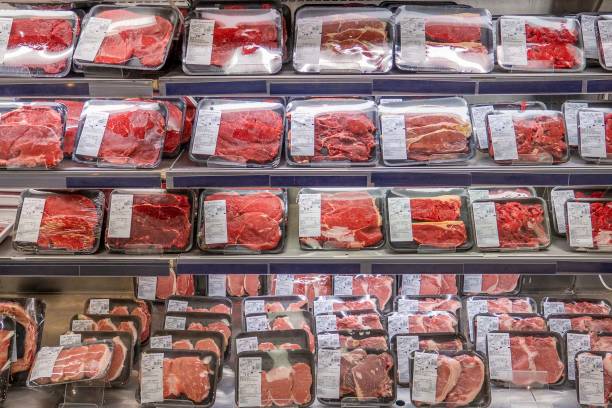 Meat department in a supermarket Big variety of cow and pork meats bakelite stock pictures, royalty-free photos & images