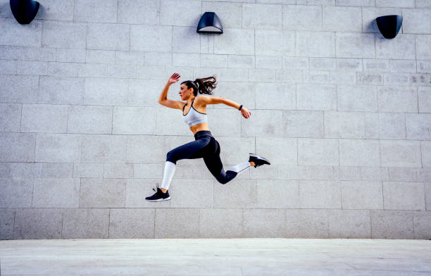istock Woman athlete jumping during exercising 1324437525