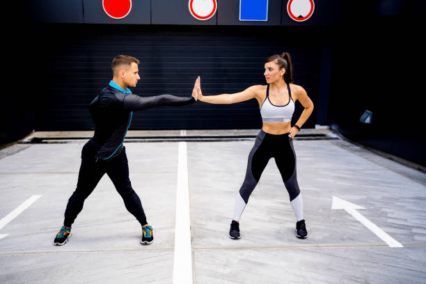 istock Fit young man and woman exercising 1324437542