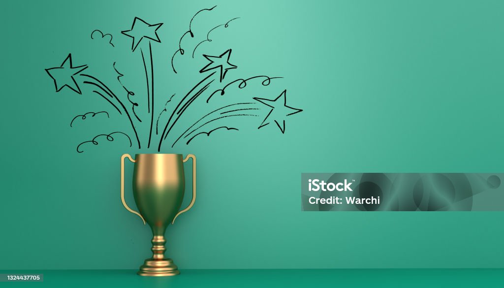 The winner Golden trophy in front of green wall with stars drawn on it to represent the winning joy Award Stock Photo